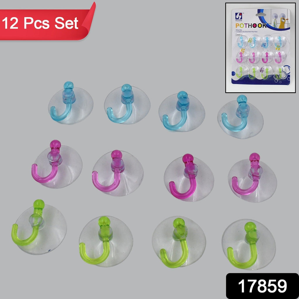 Single transparent rubber vacuum hook securely attached to a smooth wall surface.
