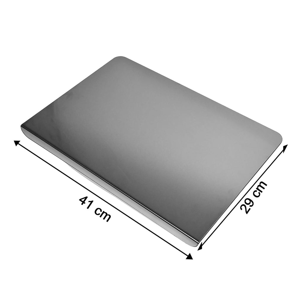Stainless steel chopping board placed on kitchen counter for vegetable cutting