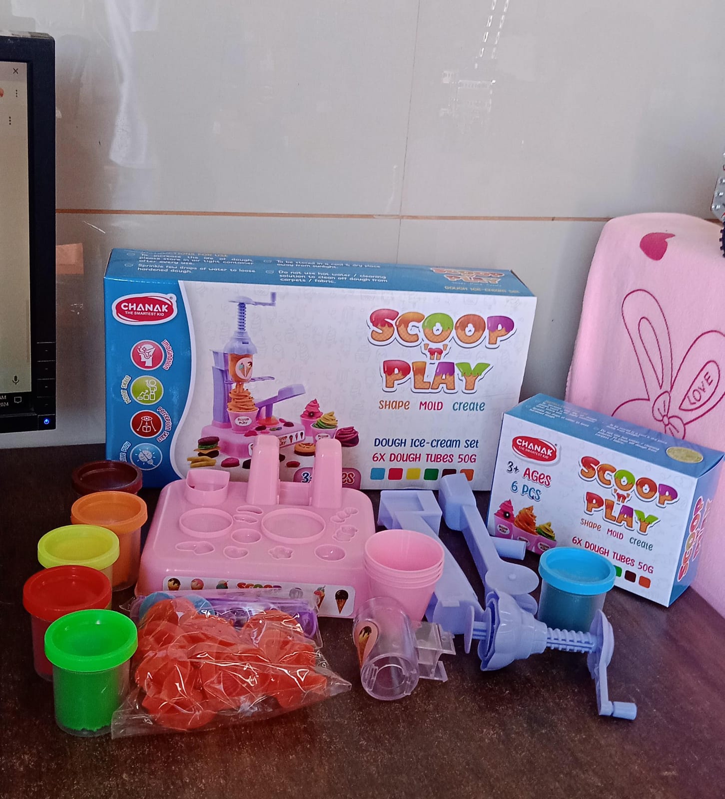 Detailed view of the cookie machine and dough tools from the creative play dough set.
