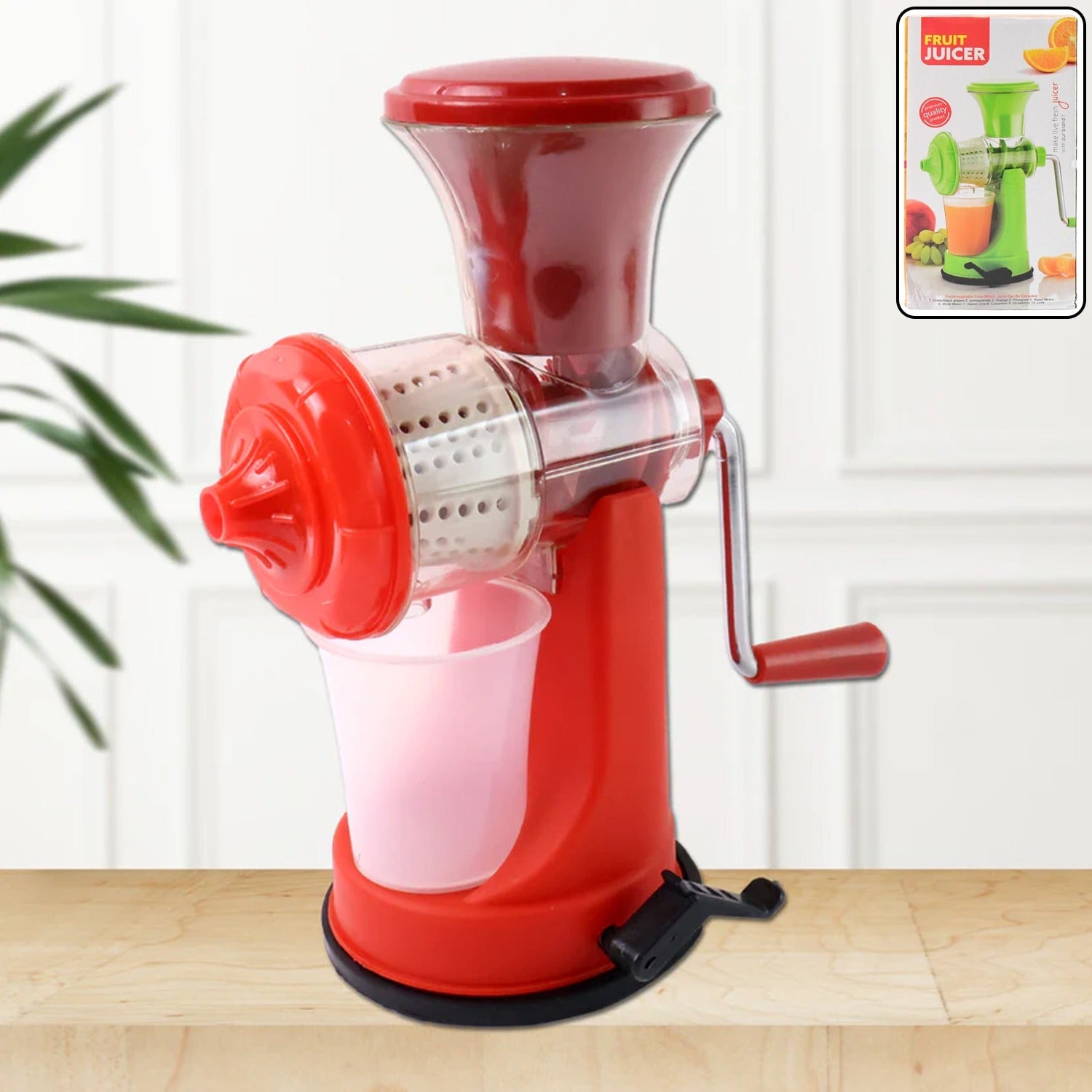 Manual fruit and vegetable juicer with strong suction base, ready for use.