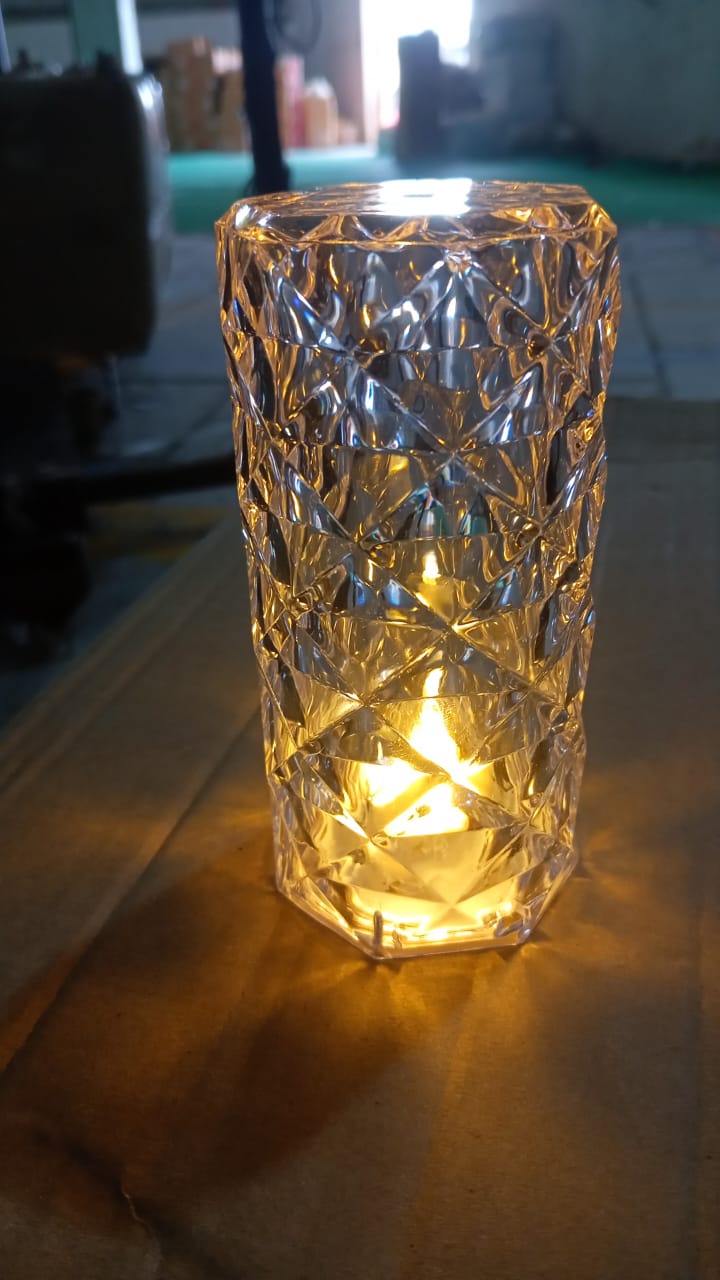 Detailed view of the transparent body and internal glitter of the Crystal LED Candle.