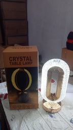 The sleek design of the crystal table lamp from a side view.