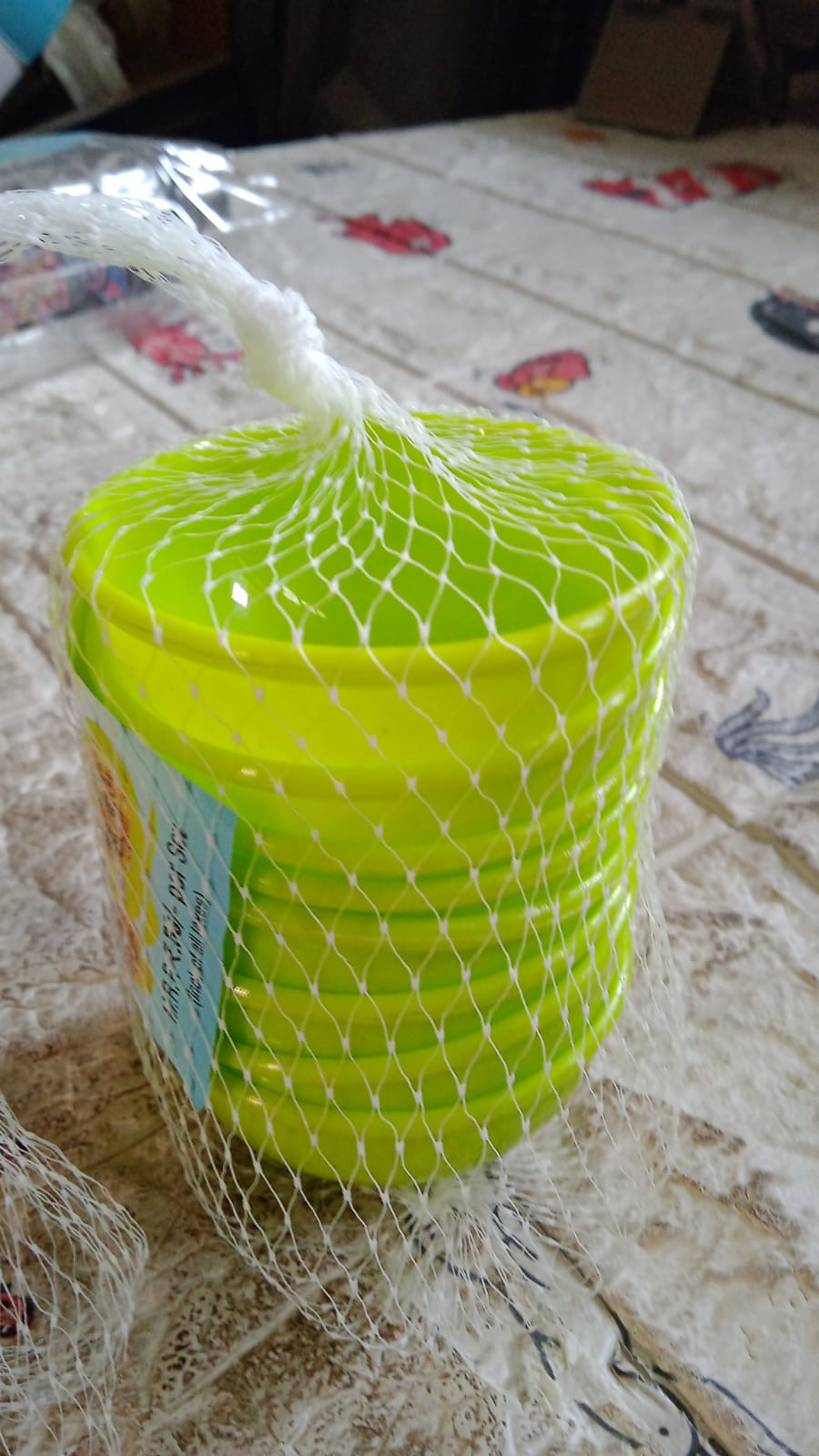 Complete set of 8 plastic bowls displayed on a clean kitchen counter.
