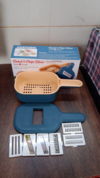 All components of the Quickslice 6-blade vegetable slicer disassembled for easy cleaning.
