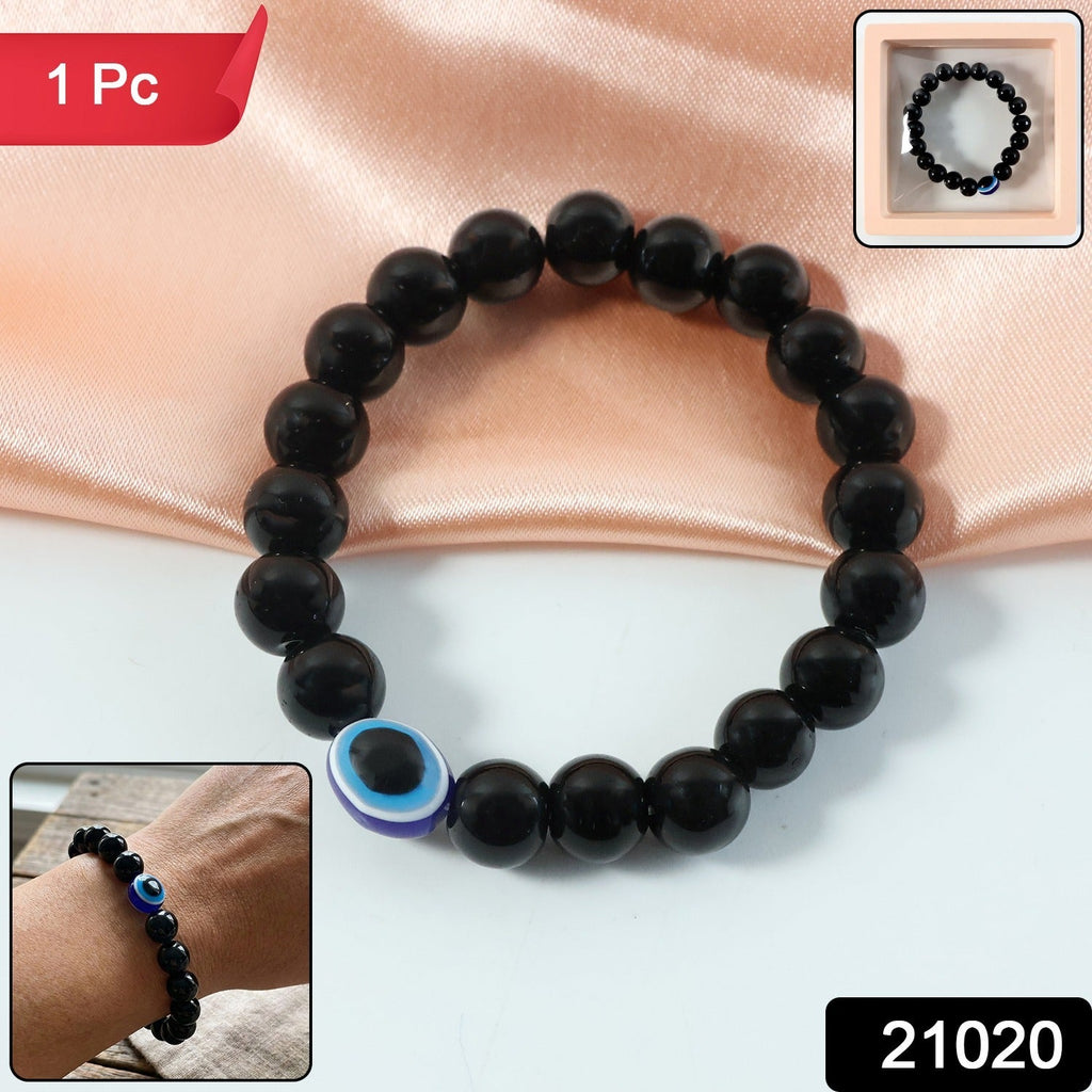 Close-up of smooth glossy dual-tone crystal-style beads on stretchy bracelet