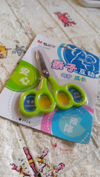 Close-up of multipurpose stainless steel scissors with comfort handles.