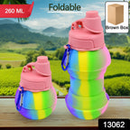 Folded silicone sports bottle with a convenient snap hook for portability.