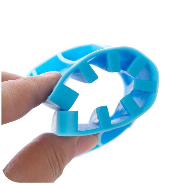 Compact white silicone drainage soap tray next to a sink.