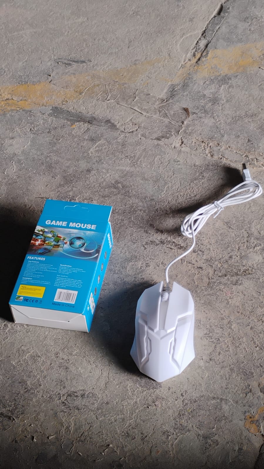 Side profile of the Indo Glow wired gaming mouse, illustrating its natural hand fit.