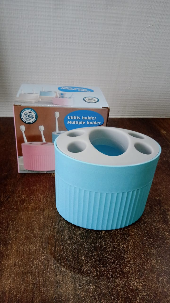 Bathroom countertop toothbrush and utility holder with waterproof design