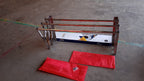 Installed wall-mounted folding stainless steel drying rack holding clothes