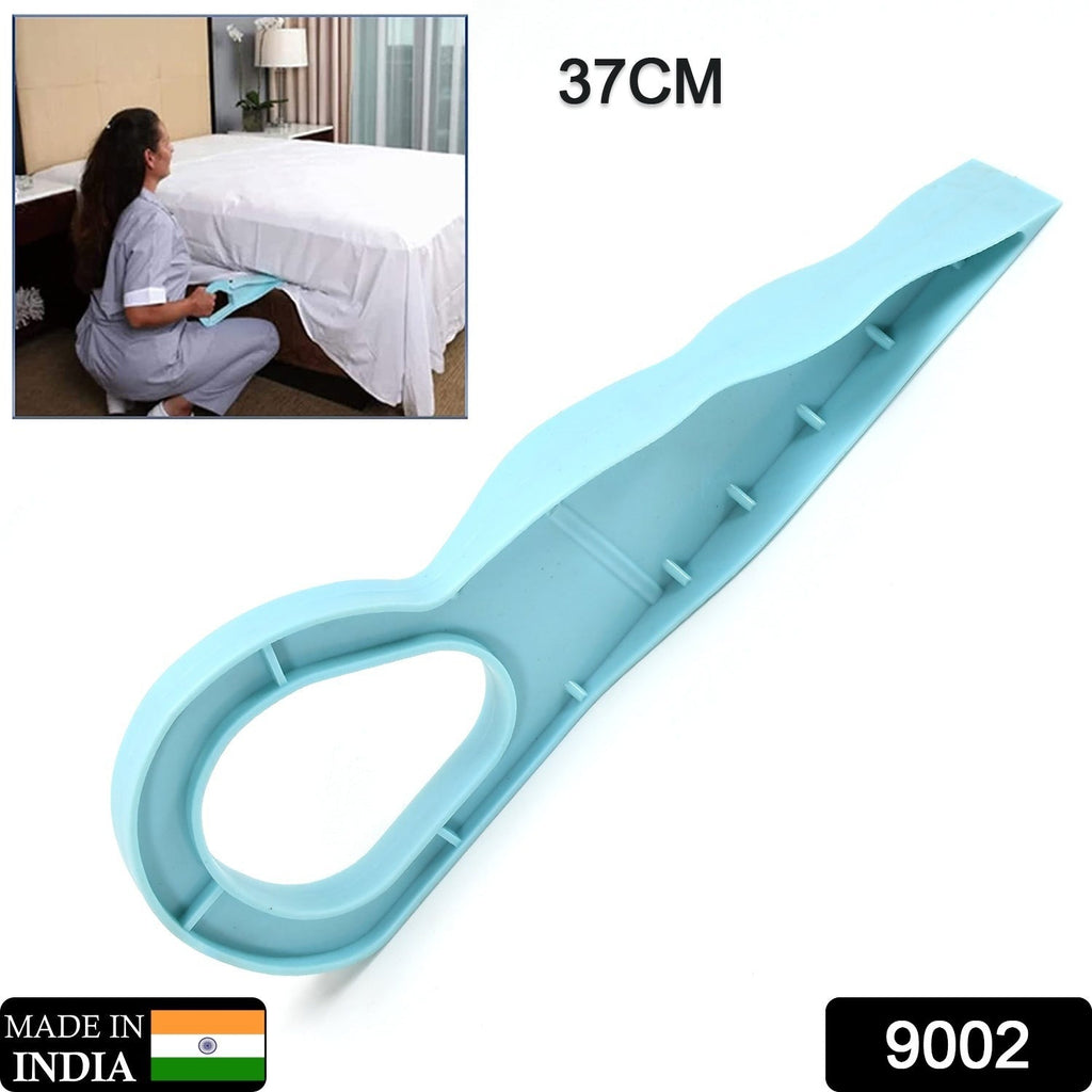 Person using the mattress lifter tool to easily change bed sheets.
