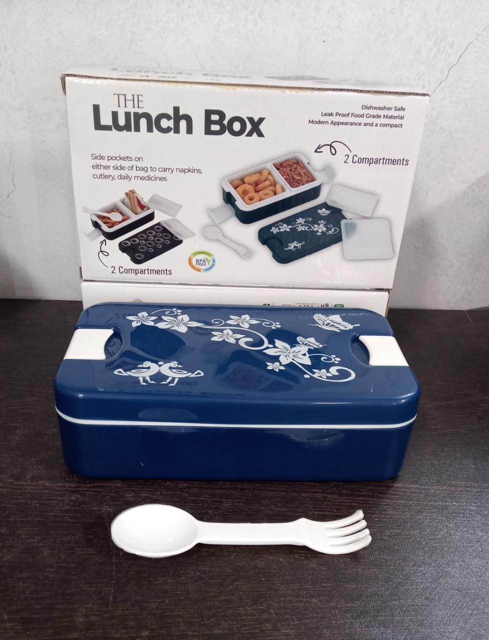 Dark blue airtight lunch box showcasing its sleek design and secure clasps.