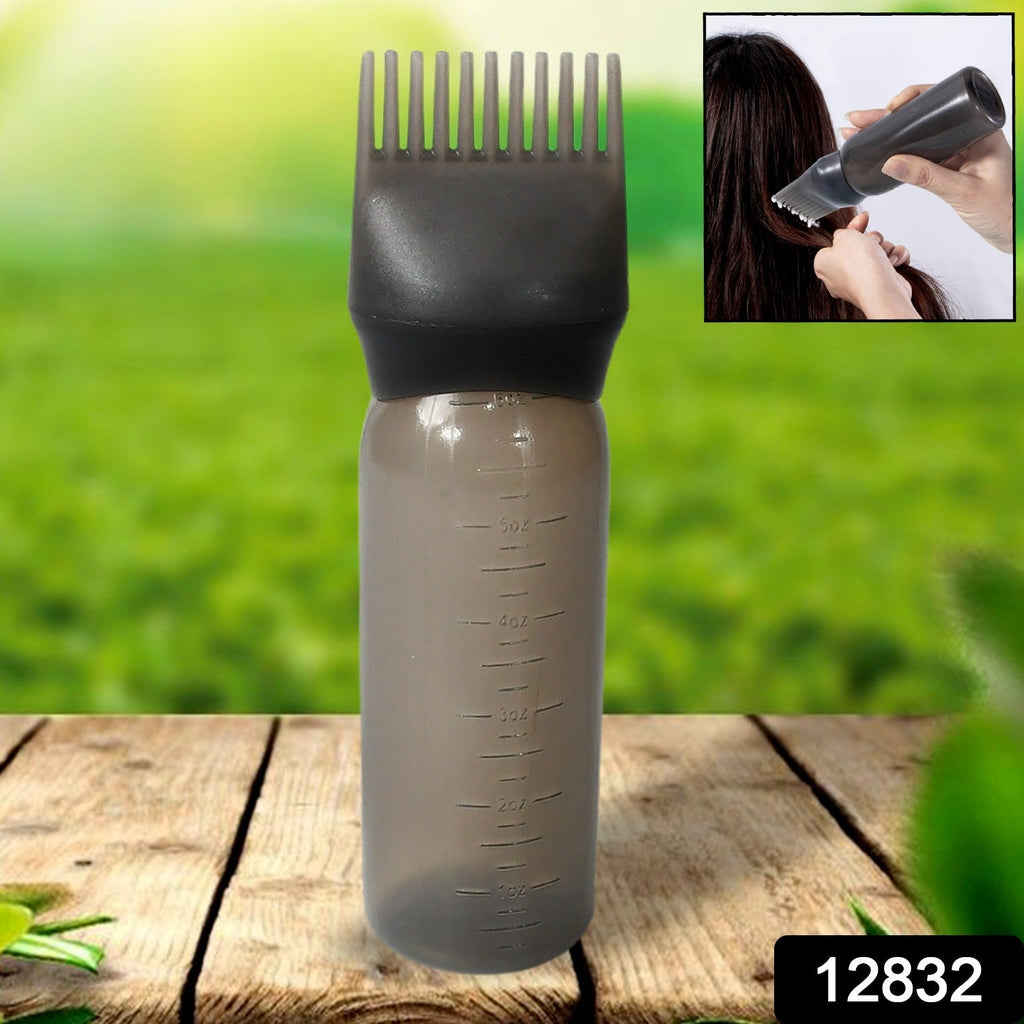 Close-up of the comb applicator brush and pump handle, showing fine bristles.