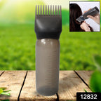 Close-up of the comb applicator brush and pump handle, showing fine bristles.