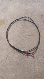 The effective drain cleaner tool with its spring and claw, designed for easy clog removal.