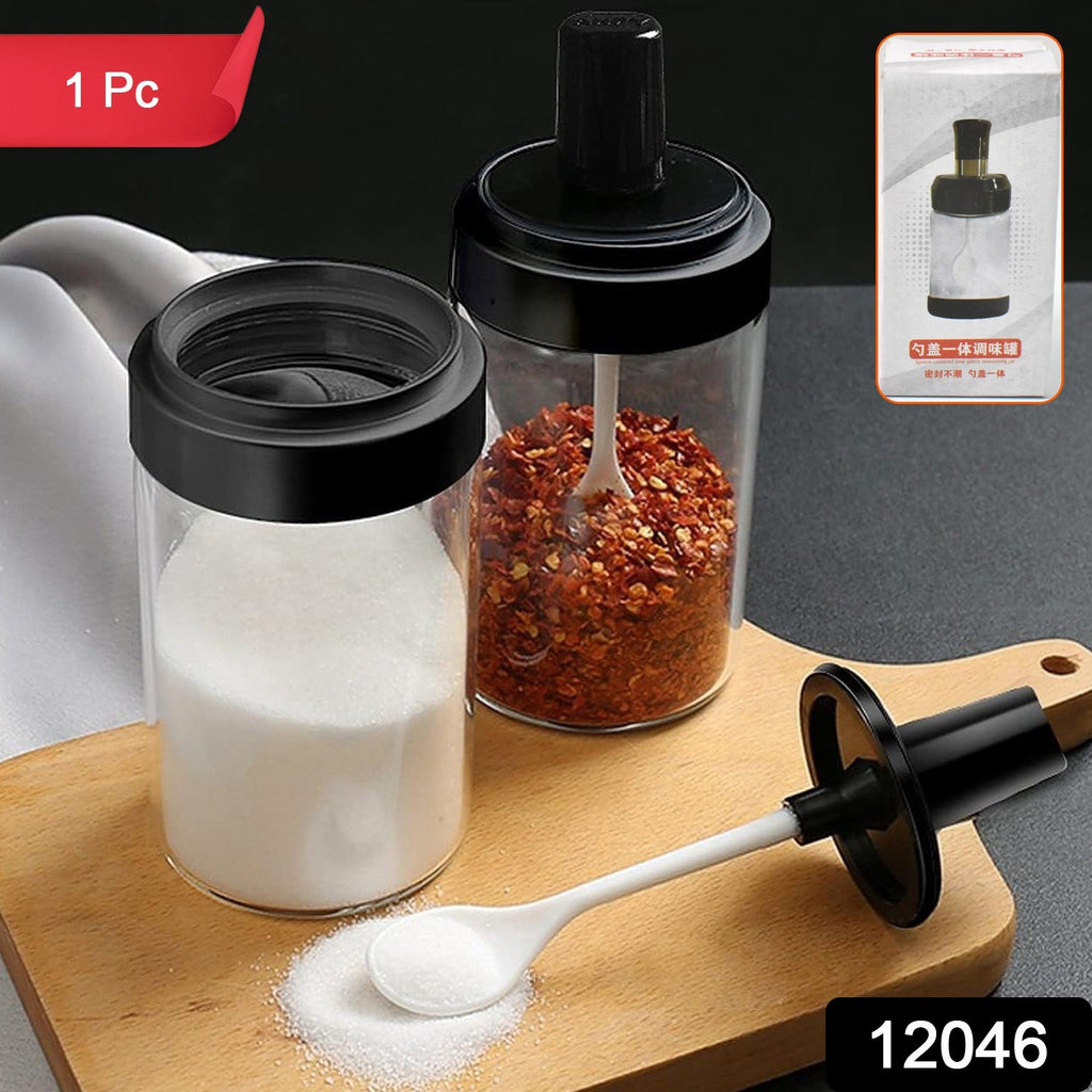 Tidy Table glass spice jars displayed neatly on a wooden tray on a modern kitchen counter.