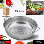 Large metal mesh strainer basket filled with fresh, vibrant green vegetables.