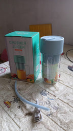Portable juicer featuring an ergonomic handle design for comfortable carrying.