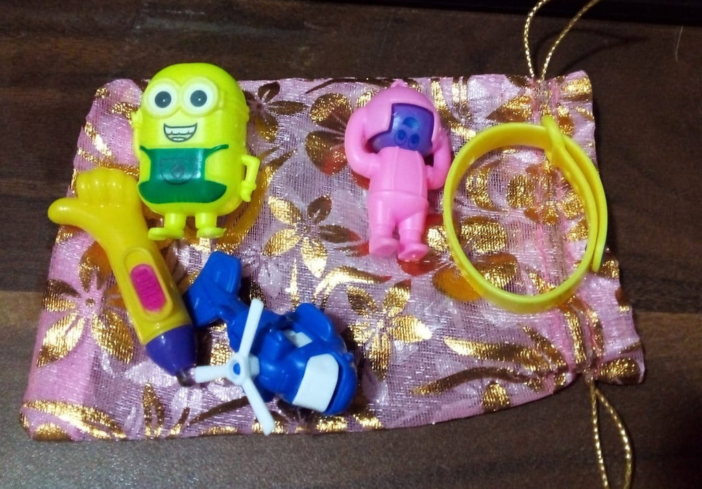The Aditi Kids Toy Combo packaging, showing the Potli bag and a glimpse of toys.