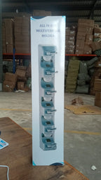 The versatile wall mounted mop holder shown with various cleaning and garden tools.
