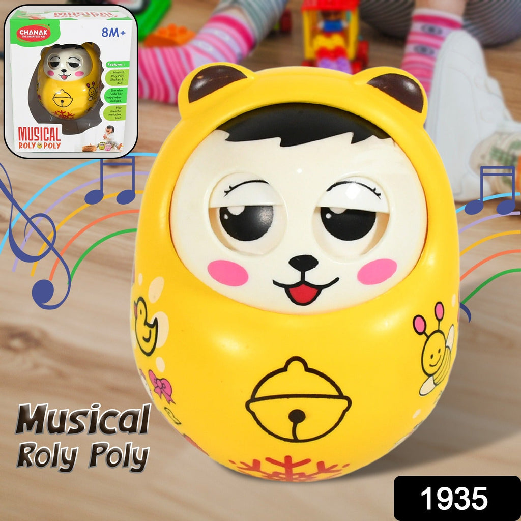 Happy baby playing with the wobbling musical roly poly toy on a mat
