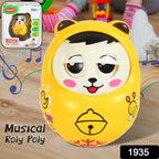 Happy baby playing with the wobbling musical roly poly toy on a mat
