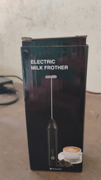 Alternative angle view of cordless electric milk frother with stainless steel whisk