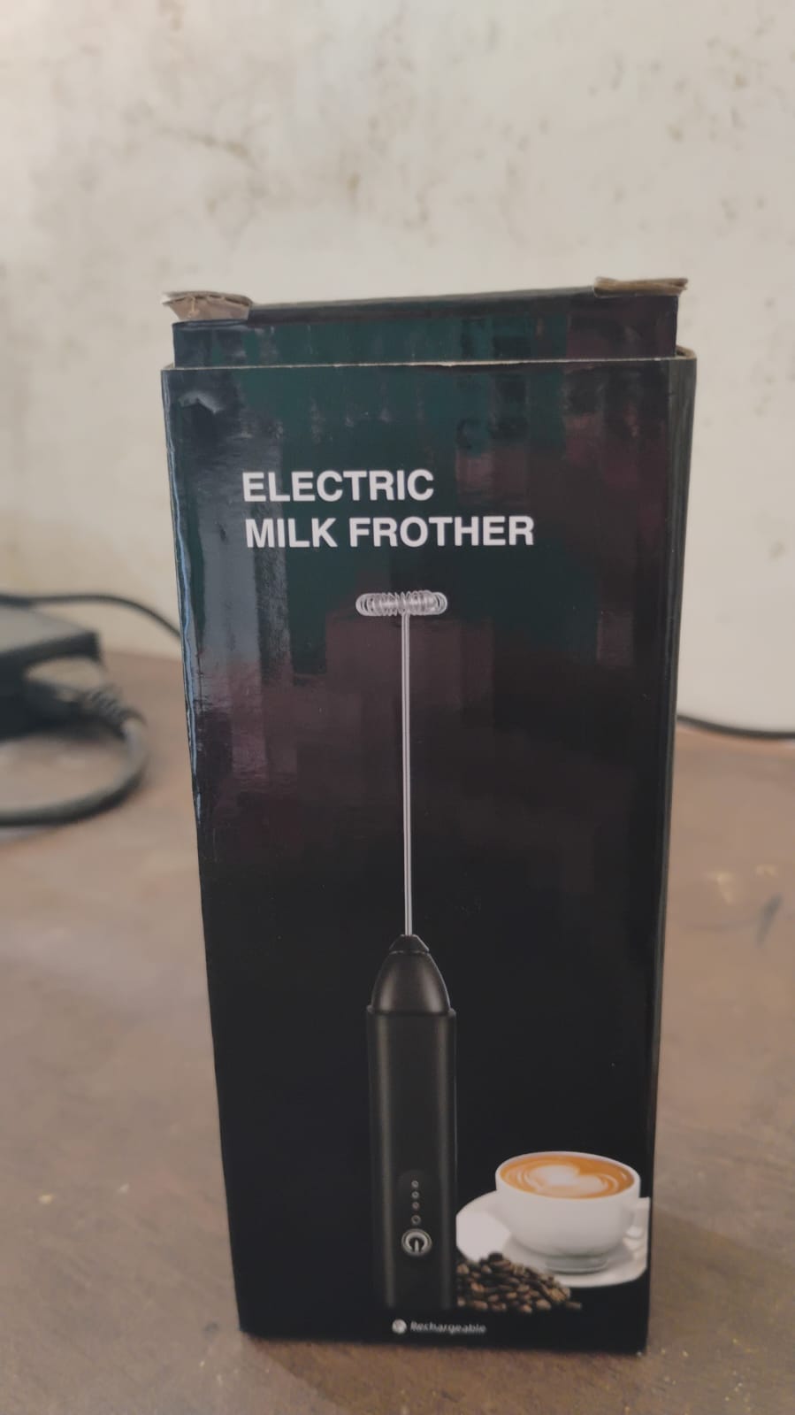 Alternative angle view of cordless electric milk frother with stainless steel whisk