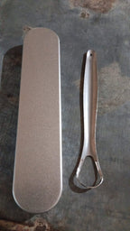 Packaging for the MintGuard stainless steel tongue scraper.