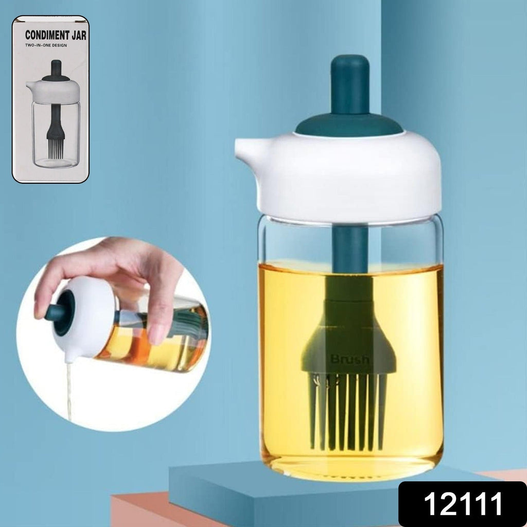 Close-up of the borosilicate glass oil dispenser with its integrated silicone brush.