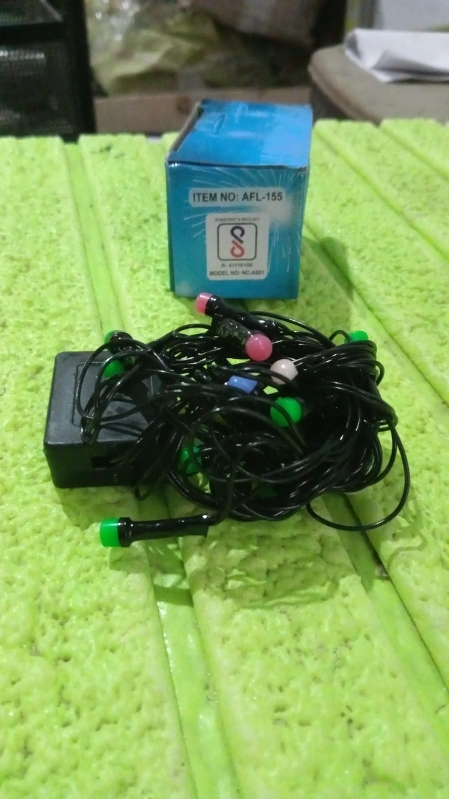 Detailed view of the multi-color LED bulbs on the string lights.