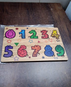 Detailed close-up of the smooth, child-safe wooden number puzzle pieces.