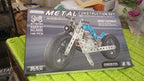 Full set of the Metal Bike Construction Kit showing all parts, tools, and instructions.