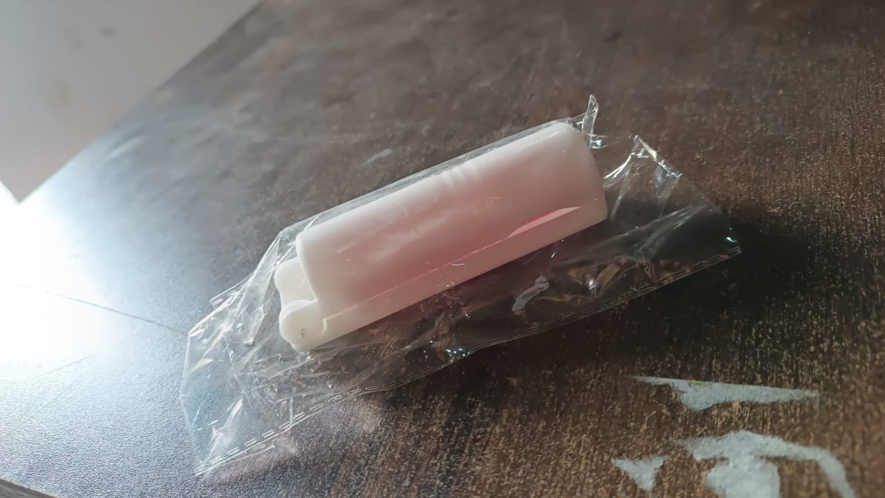 The reusable lint roller with collected lint and hair, ready for washing.