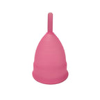 Close-up of a silicone reusable menstrual cup, highlighting its design.