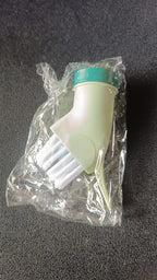 Cleaning brush connected to water bottle for easy water dispensing while scrubbing