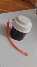 Transparent plastic pill organizer showing multiple compartments