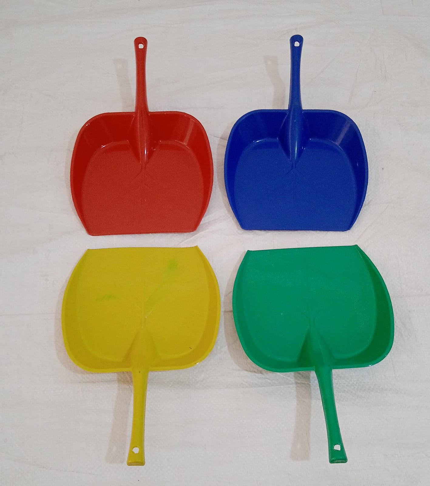Versatile long handle dustpan for home and office cleaning.