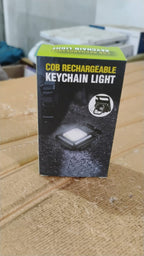 Side view of the rechargeable keychain flashlight with its magnetic base.