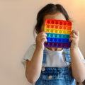 Rainbow colored push bubble fidget toy in assorted random shapes