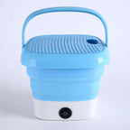 Mini folding washer on a clean background, highlighting its compact size for travel.
