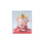 Close-up image highlighting bright red and gold details on Ganesha idol