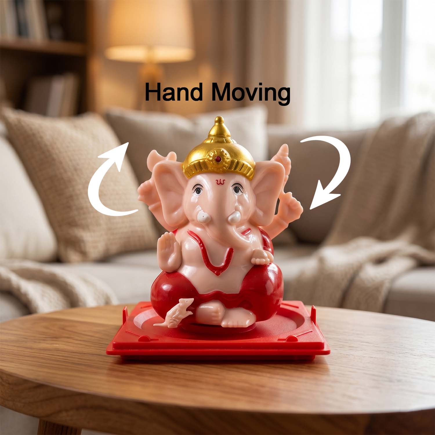 Detailed view of Ganesha idol showcasing intricate red and gold accents