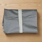 Multiple breathable garment covers neatly organized in wardrobe