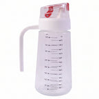 Clear 500ml glass oil dispenser with white handle and red auto-flip cap on white background
