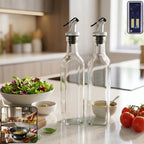 Transparent square glass oil dispenser bottles with stainless steel spouts for kitchen use