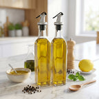 Glass oil dispenser filled with olive oil on kitchen counter