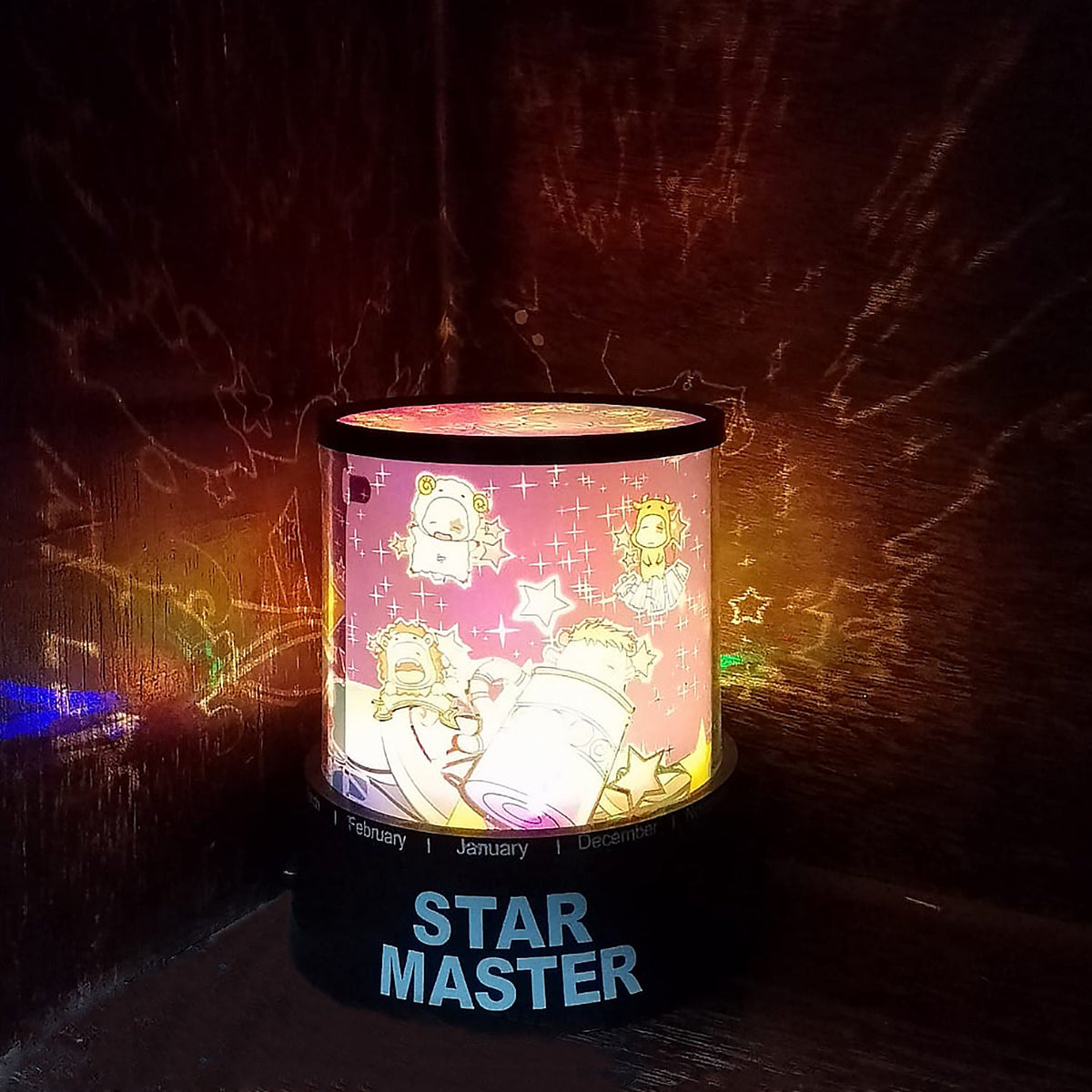 LED projector night light creating a starry sky ambiance in a dark room.