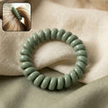 Spiral coil hair tie in black, flexible and waterproof for all hair types